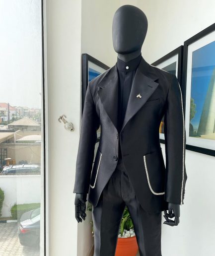 The Monochrome “okorodudu” mikado satin, charcoal black, big-notch lapel suit.