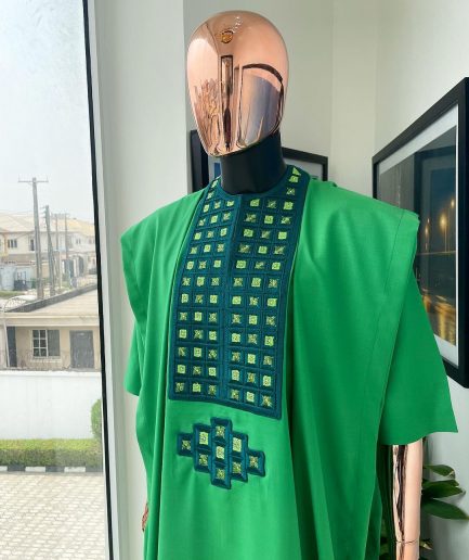 A Shamrock green, connected square embroidery design with matching silver and parakeet green Swarovski stone details agbada