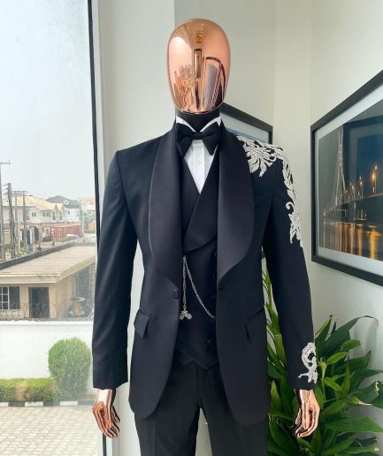 The “Trailblazers” charcoal black, shawl lapel tuxedo suit with metallic silver adornments
