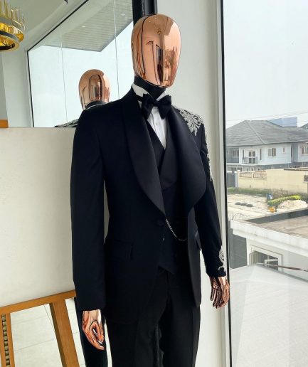 The “Trailblazers” charcoal black, shawl lapel tuxedo suit with metallic silver adornments