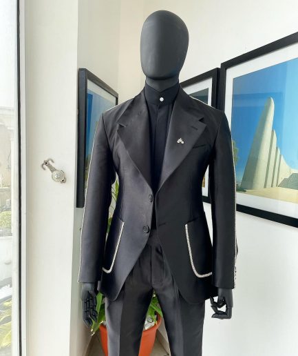 The Monochrome “okorodudu” mikado satin, charcoal black, big-notch lapel suit.