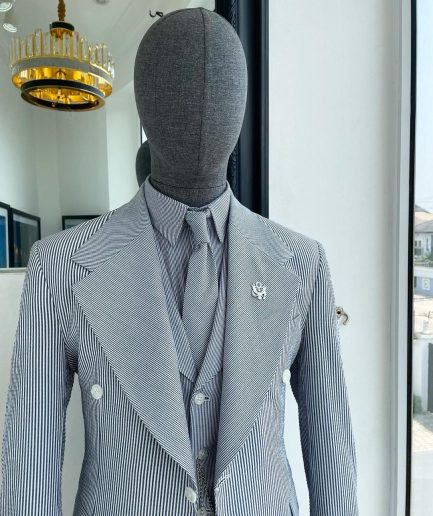 A monochrome seersucker (rail road stripe) notch lapel suit