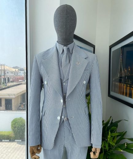 A monochrome seersucker (rail road stripe) notch lapel suit