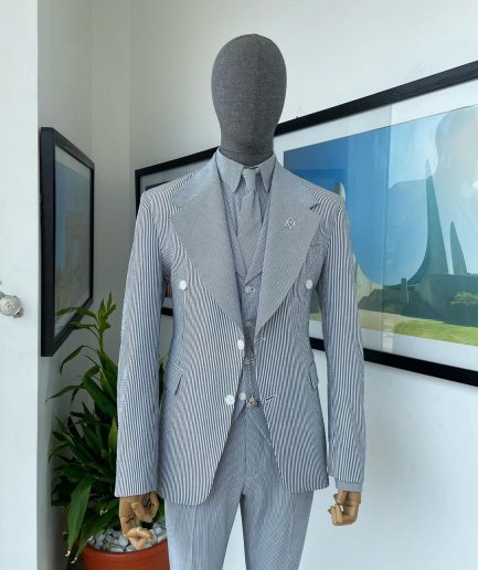 A monochrome seersucker (rail road stripe) notch lapel suit