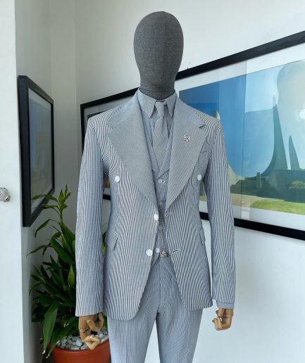 A monochrome seersucker (rail road stripe) notch lapel suit