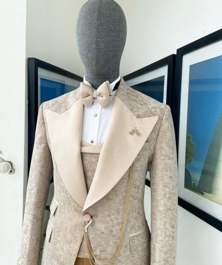 A splash of tortilla and wheat brown peak lapel metallic jacquard tuxedo suit