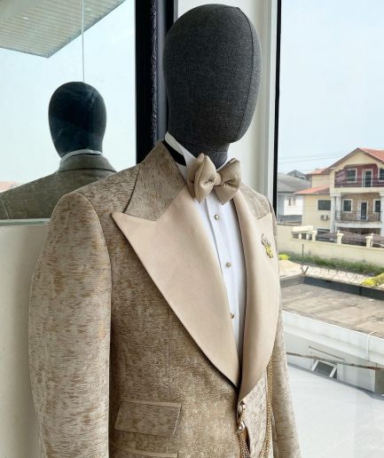 A splash of tortilla and wheat brown peak lapel metallic jacquard tuxedo suit