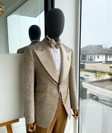 A splash of tortilla and wheat brown peak lapel metallic jacquard tuxedo suit