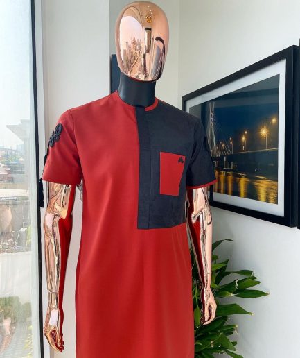 A Rosso corsa red, half cut black paisley detailing with mandarin knot button detailing african traditional senator kaftan native