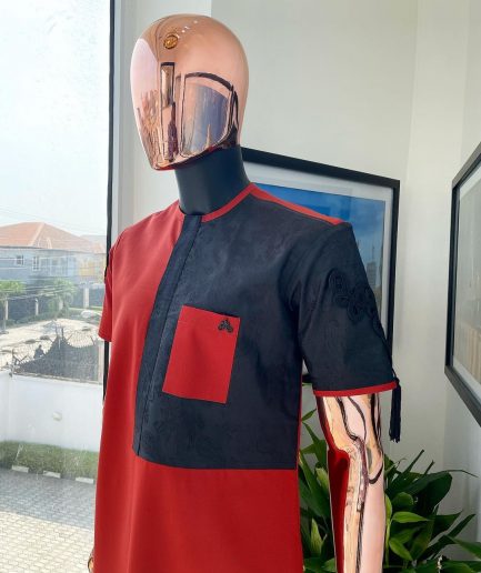 A Rosso corsa red, half cut black paisley detailing with mandarin knot button detailing african traditional senator kaftan native