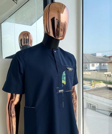 A Navy blue, multileg intersection pocket with clear view flap Swarovski button detailing african traditional senator kaftan native.