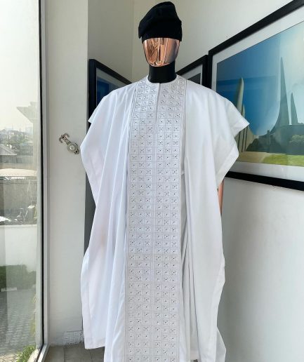 A white, connected square embroidery design with matching silver and black Swarovski stone details agbada