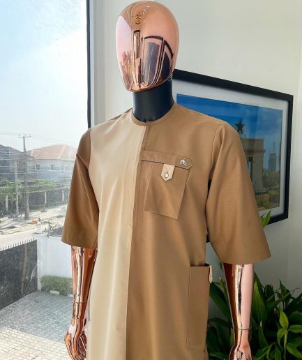 A Tortilla and peanut brown combat front and side pocket with a clear view of Swarovski stone detailing African traditional senator Kaftan native.