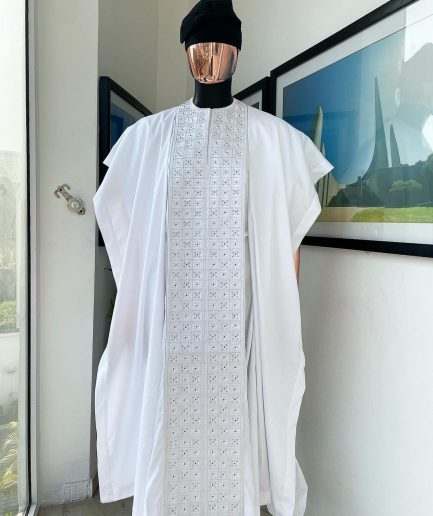 A white, connected square embroidery design with matching silver and black Swarovski stone details agbada