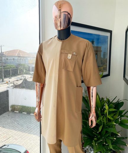 A Tortilla and peanut brown combat front and side pocket with a clear view of Swarovski stone detailing African traditional senator Kaftan native.