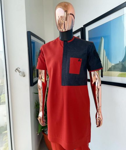 A Rosso corsa red, half cut black paisley detailing with mandarin knot button detailing african traditional senator kaftan native