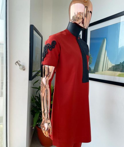 A Rosso corsa red, half cut black paisley detailing with mandarin knot button detailing african traditional senator kaftan native