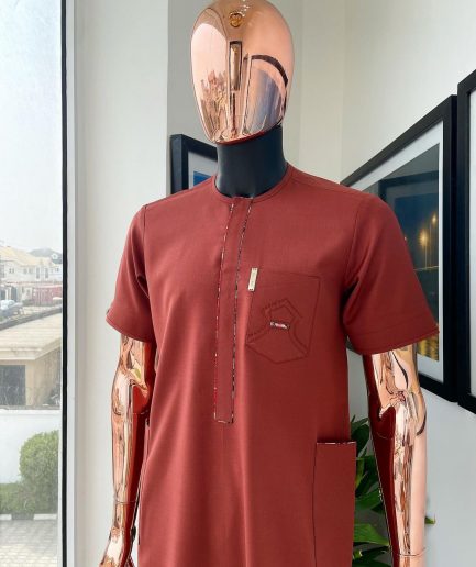 An Amber orange, paisley mountain top patch pocket detailing African traditional senator Kaftan native.