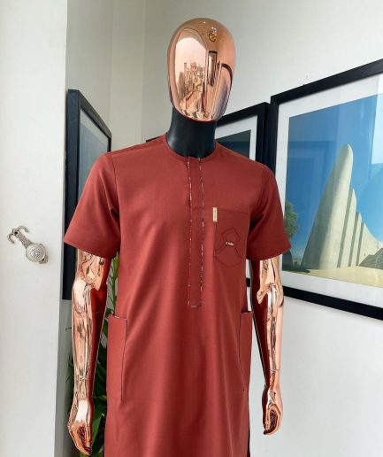 An Amber orange, paisley mountain top patch pocket detailing African traditional senator Kaftan native.