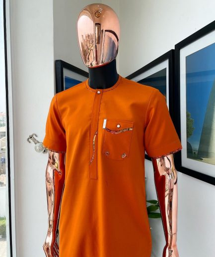 A Fire orange, combat pocket with matching paisley and Swarovski button detailing african traditional senator kaftan native.