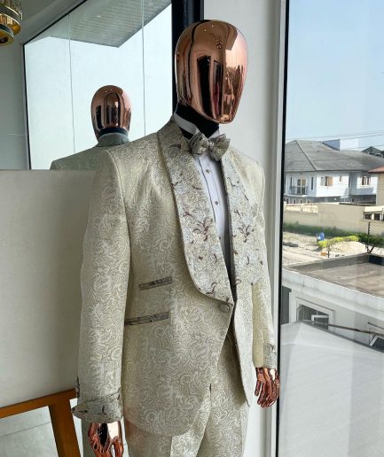 A gold print pattern tuxedo suit, contemplation cream with maroon, champagne gold floral metallic jacquard shawl lapel