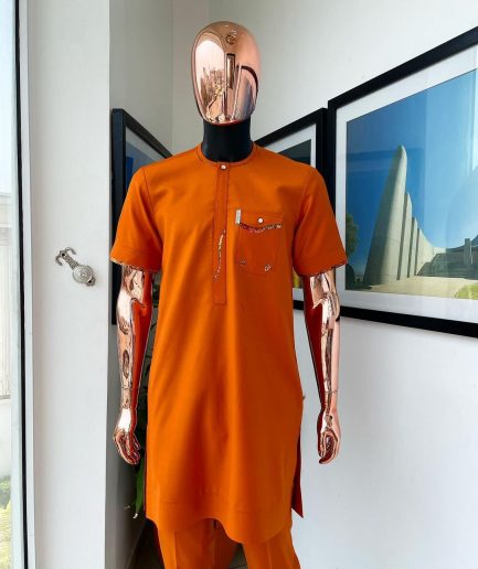 A Fire orange, combat pocket with matching paisley and Swarovski button detailing african traditional senator kaftan native.