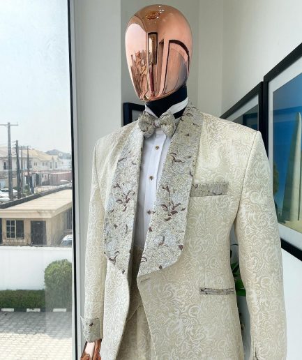 A gold print pattern tuxedo suit, contemplation cream with maroon, champagne gold floral metallic jacquard shawl lapel