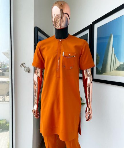 A Fire orange, combat pocket with matching paisley and Swarovski button detailing african traditional senator kaftan native.