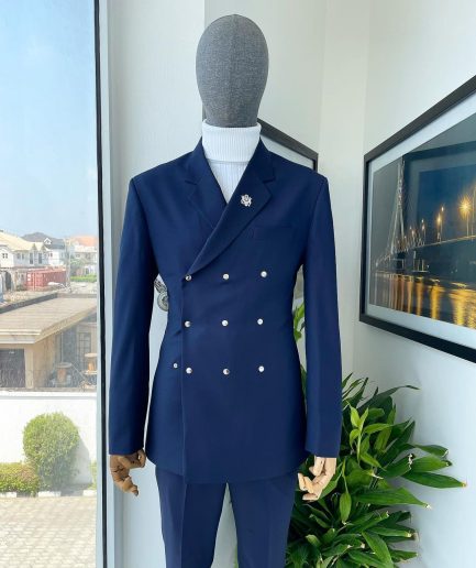 An Navy blue “ibiza” wrap suit with snap buttons detailing