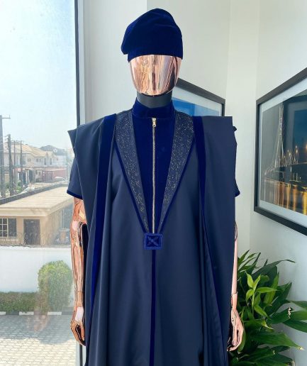 A Midnight blue, vehicular lapelled with zip line flap & navy blue soaked Italian velvet mix embroidery design details agbada