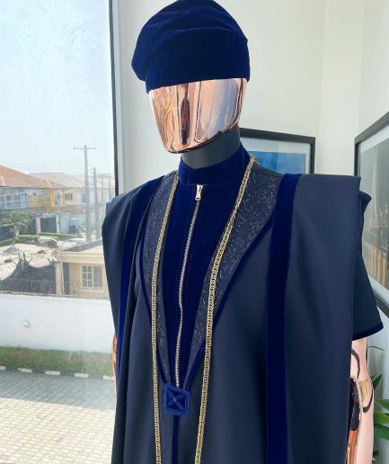 A Midnight blue, vehicular lapelled with zip line flap & navy blue soaked Italian velvet mix embroidery design details agbada