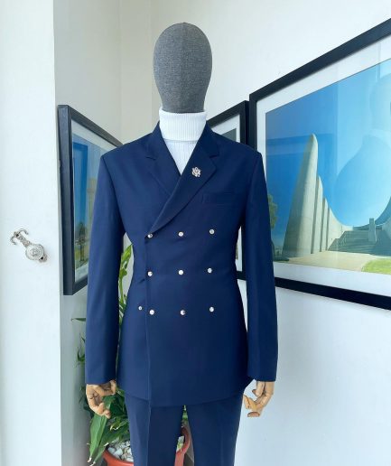 An Navy blue “ibiza” wrap suit with snap buttons detailing