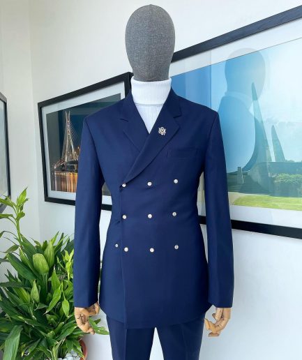 An Navy blue “ibiza” wrap suit with snap buttons detailing