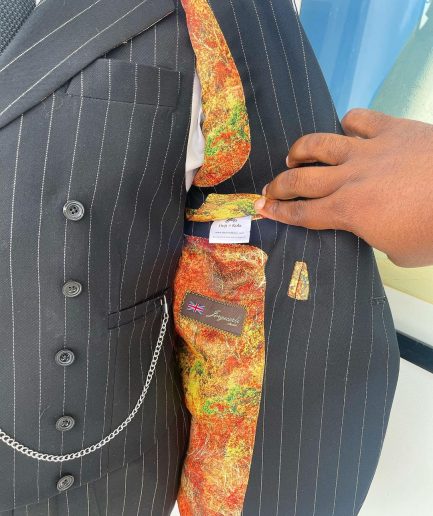A charcoal black & white pencil stripe Jorgecarli ceremonial super 140's “Board Room” notch lapel patch pocket suit