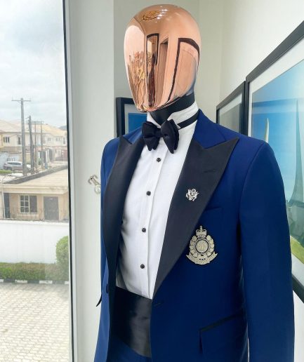 A Navy blue peak lapel tuxedo suit