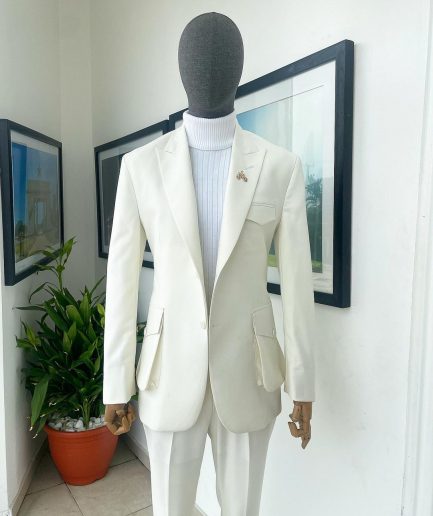 An Ivory white, x-large combat patch pocket, peak lapel suit