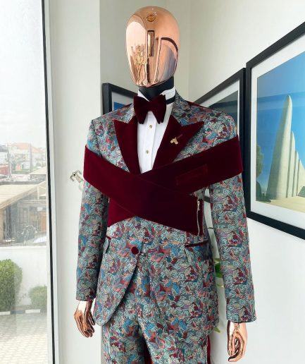 An “octopus” floral paisley tuxedo with intersected mahogany red soaked Italian velvet peak lapel suit