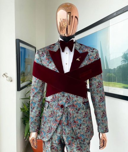 An “octopus” floral paisley tuxedo with intersected mahogany red soaked Italian velvet peak lapel suit