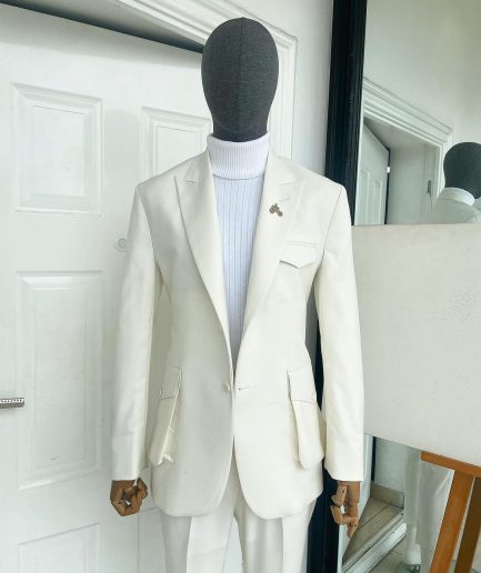 An Ivory white, x-large combat patch pocket, peak lapel suit