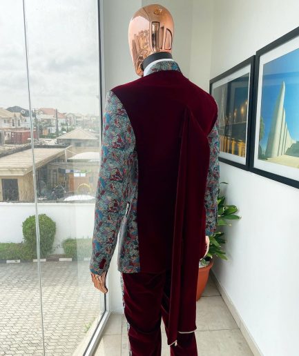 An “octopus” floral paisley tuxedo with intersected mahogany red soaked Italian velvet peak lapel suit