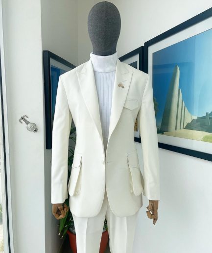 An Ivory white, x-large combat patch pocket, peak lapel suit