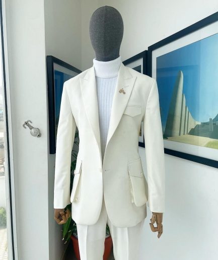 An Ivory white, x-large combat patch pocket, peak lapel suit
