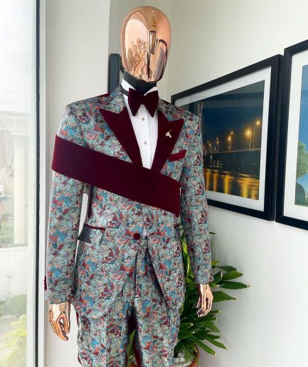 An “octopus” floral paisley tuxedo with right side strap mahogany red soaked Italian velvet peak lapel suit