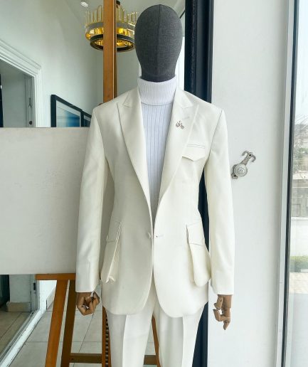 An Ivory white, x-large combat patch pocket, peak lapel suit