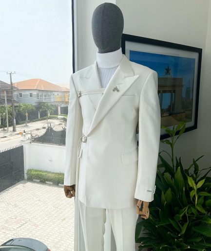 A wrap and strapped ivory white, peak lapel suit