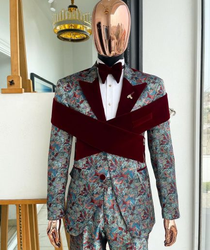 An “octopus” floral paisley tuxedo with intersected mahogany red soaked Italian velvet peak lapel suit
