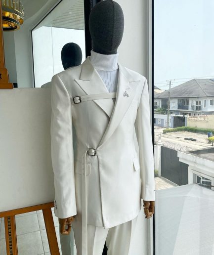 A wrap and strapped ivory white, peak lapel suit