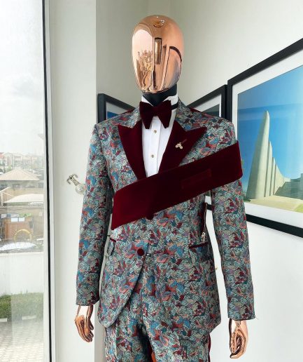 An “octopus” floral paisley tuxedo with left side strap mahogany red soaked Italian velvet peak lapel suit