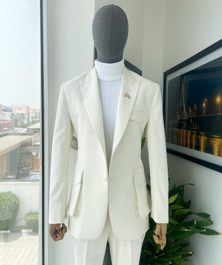 An Ivory white, x-large combat patch pocket, peak lapel suit