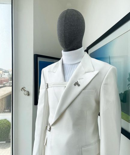 A wrap and strapped ivory white, peak lapel suit